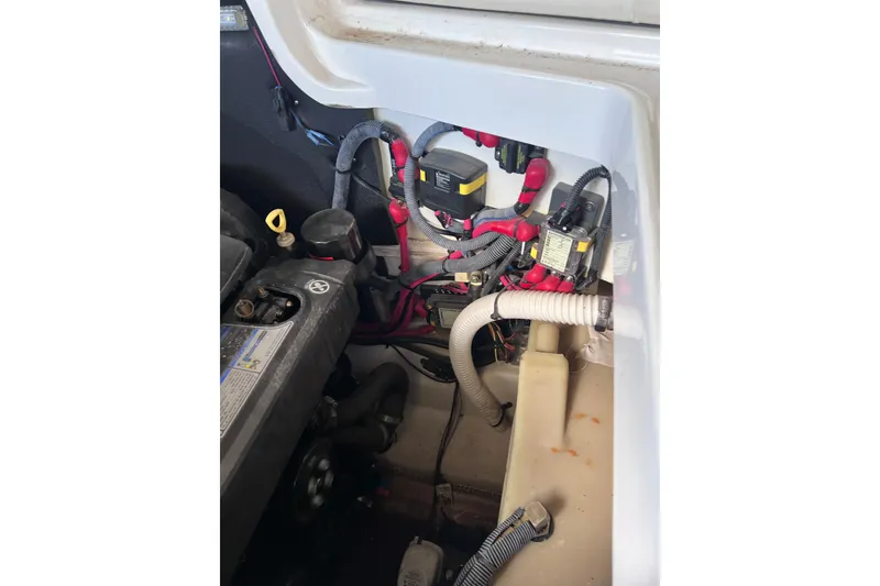 Slide: The Image of Engine compartment of a 2018 Sea Ray SLX 250 boat, showing wiring and components. - 27