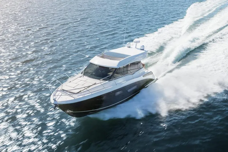 The Image of Manufacturer Provided Image: 2026 Regal 42 Grande Coupe cruising on open water, showcasing sleek design and performance. - 0