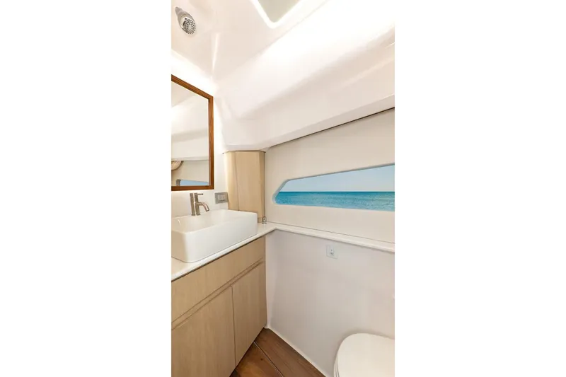 Slide: The Image of Manufacturer Provided Image: Luxurious bathroom interior of 2026 Regal 42 Grande Coupe yacht with ocean view. - 12