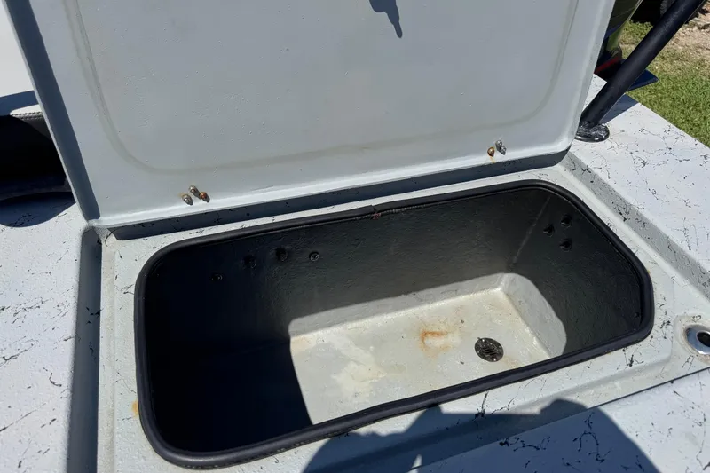 Slide: The Image of Open storage compartment on a 2016 El Pescador 24 CAT boat. - 11