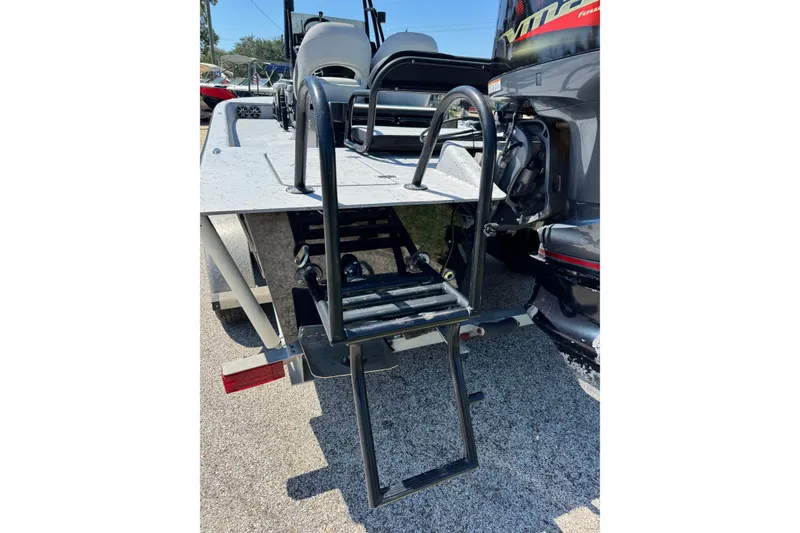 Slide: The Image of Rear view of 2016 El Pescador 24 CAT boat with ladder and motor. - 12