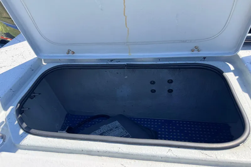 Slide: The Image of Open storage compartment on a 2016 El Pescador 24 CAT boat. - 15
