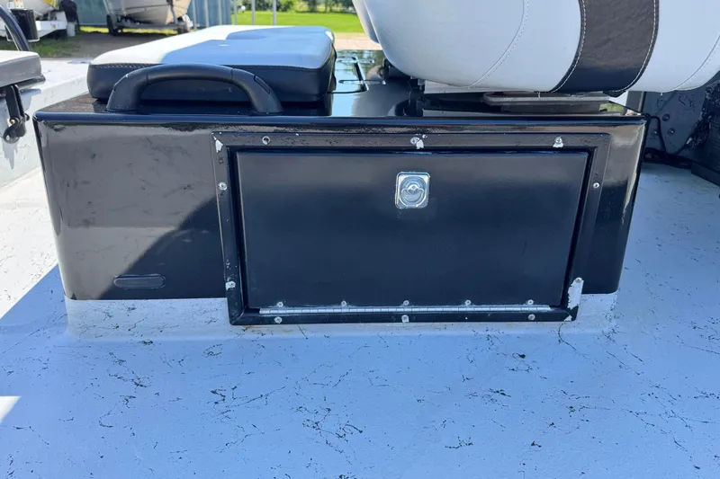 Slide: The Image of 2016 El Pescador 24 CAT boat storage compartment with cushioned seating. - 17