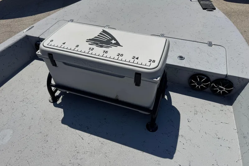 Slide: The Image of Cooler with measurement markings on a 2016 El Pescador 24 CAT boat deck. - 27