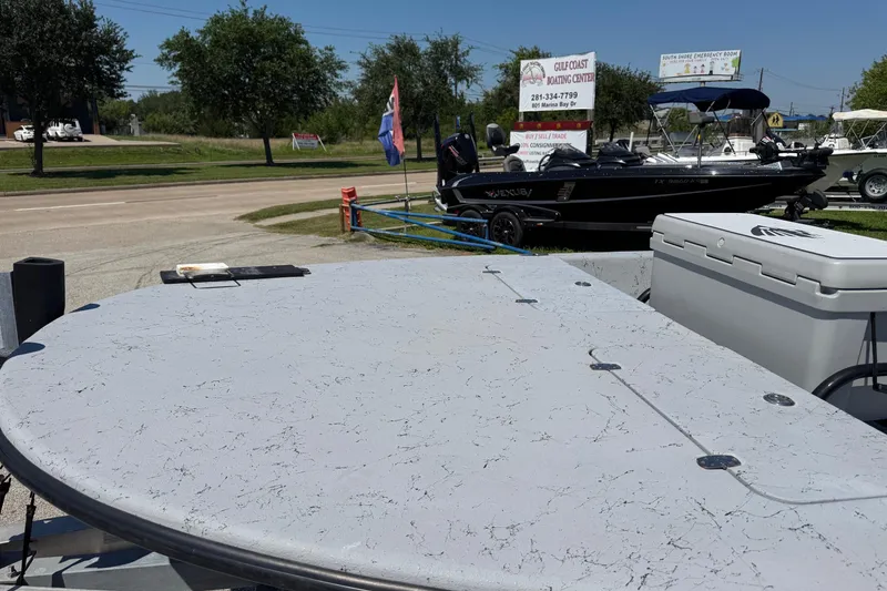 Slide: The Image of 2016 El Pescador 24 CAT boat displayed outdoors at Gulf Coast Boating Center. - 3