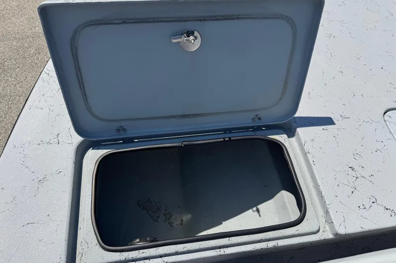 Slide: The Image of Open storage compartment on a 2016 El Pescador 24 CAT boat. - 30