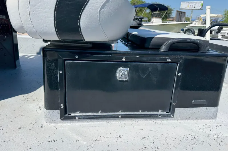 Slide: The Image of 2016 El Pescador 24 CAT boat seat and storage compartment detail. - 7