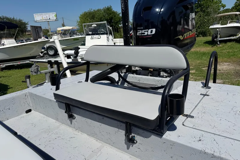 Slide: The Image of 2016 El Pescador 24 CAT boat with Yamaha 250 VMAX engine, featuring a cushioned seat. - 9