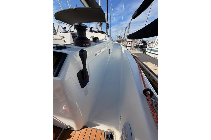 Slide: The Image of 2025 Jeanneau Sun Odyssey 350 sailboat deck with winch and control lever. - 24