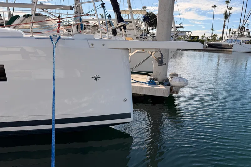 Slide: The Image of 2025 Jeanneau Sun Odyssey 350 yacht docked in a marina, side view. - 7