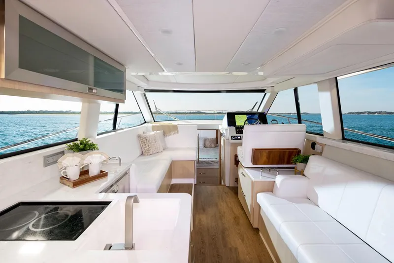 Slide: The Image of Manufacturer Provided Image: Luxurious interior of 2026 Regal 38 Fly yacht with modern furnishings and panoramic windows. - 10