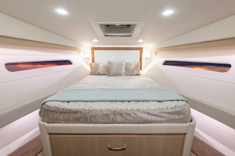 Slide: The Image of Manufacturer Provided Image: Luxurious cabin interior of 2026 Regal 38 Fly yacht with cozy bedding. - 12