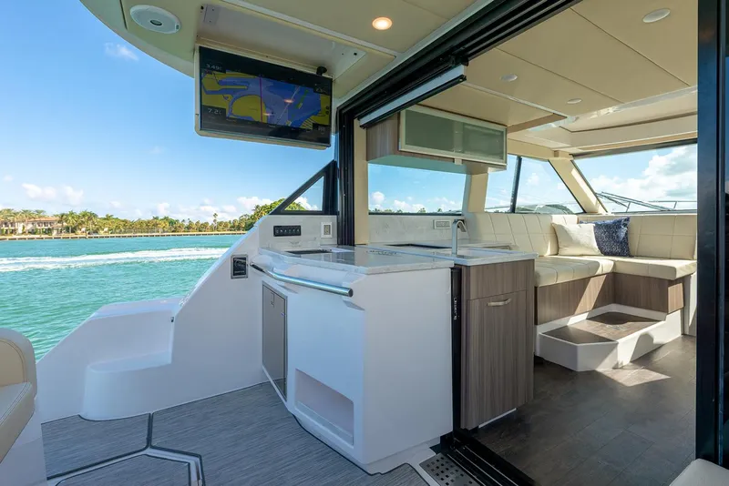 Slide: The Image of Manufacturer Provided Image: Luxurious interior of 2026 Regal 38 Fly yacht with modern kitchen and seating area. - 8