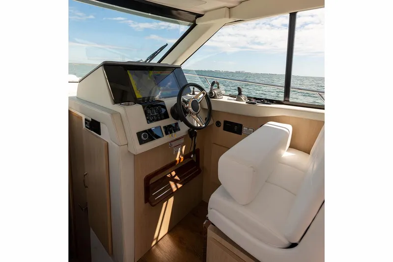 Slide: The Image of Manufacturer Provided Image: 2026 Regal 38 Fly yacht helm with modern controls and ocean view. - 9