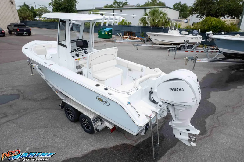 Slide: The Image of 2026 Sea Hunt Ultra 235 SE boat with Yamaha engine on trailer in marina. - 15