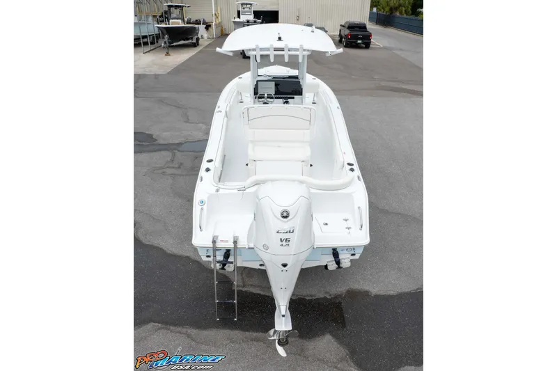 Slide: The Image of 2026 Sea Hunt Ultra 235 SE boat with outboard motor, viewed from the rear. - 18
