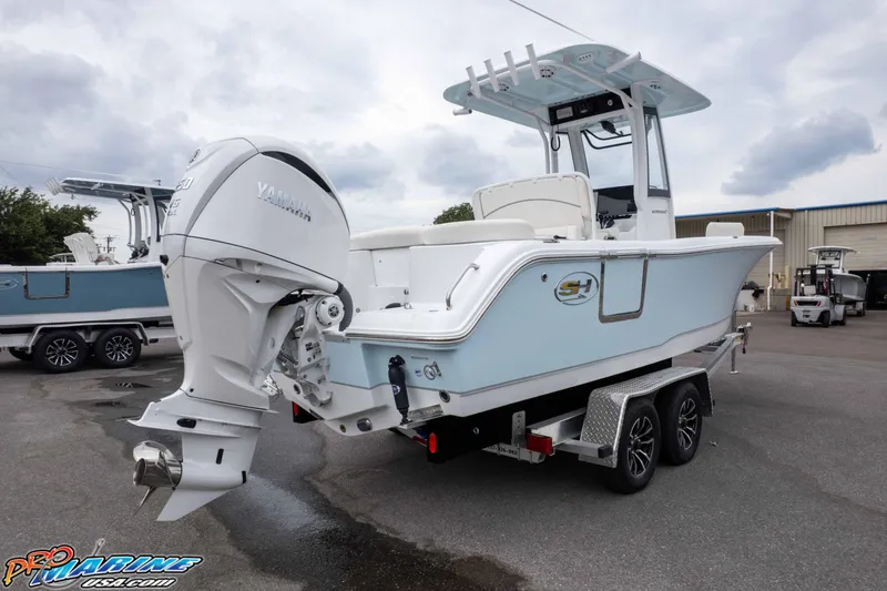 Slide: The Image of 2026 Sea Hunt Ultra 235 SE boat on trailer with Yamaha outboard motor. - 19