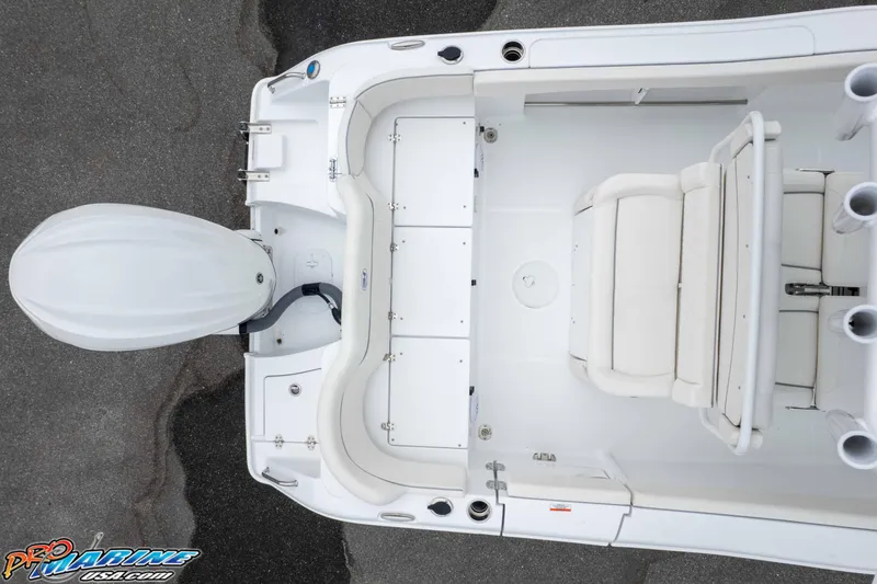 Slide: The Image of Overhead view of 2026 Sea Hunt Ultra 235 SE boat interior and engine. - 24
