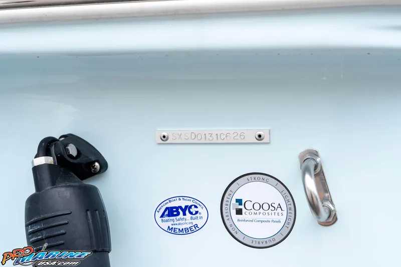 Slide: The Image of 2026 Sea Hunt Ultra 235 SE boat detail with ABYC and Coosa Composites labels. - 25