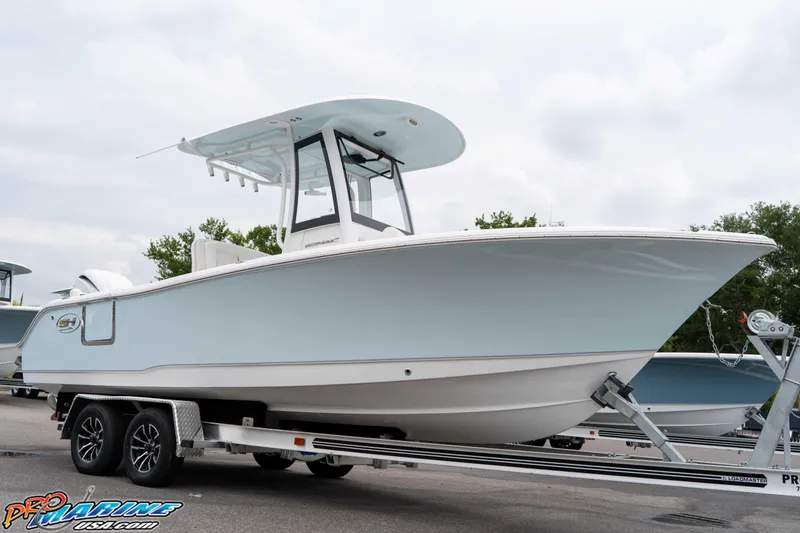 Slide: The Image of 2026 Sea Hunt Ultra 235 SE boat on trailer, side view. - 26