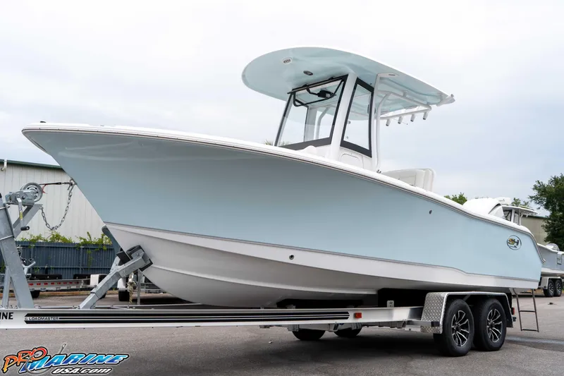 Slide: The Image of 2026 Sea Hunt Ultra 235 SE boat on trailer, side view. - 29