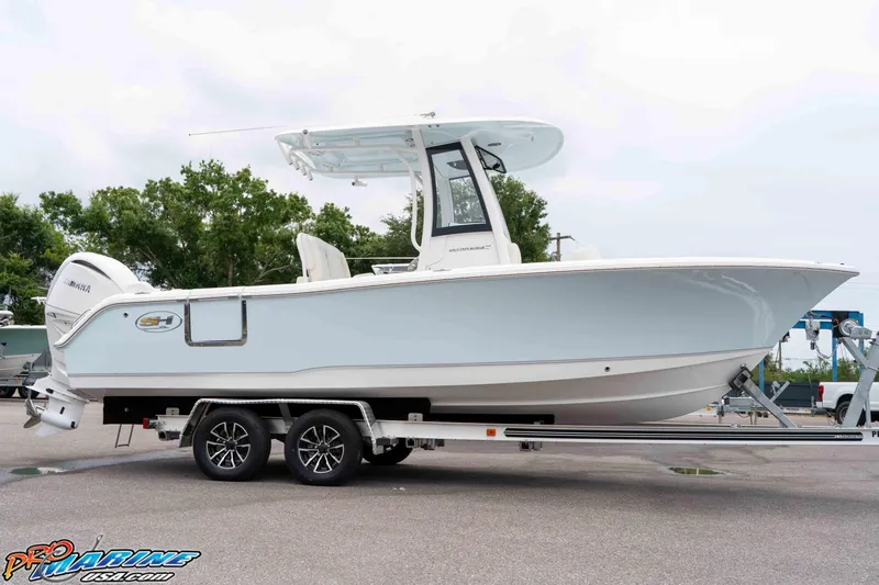 Slide: The Image of 2026 Sea Hunt Ultra 235 SE boat on trailer, side view, outdoors. - 34