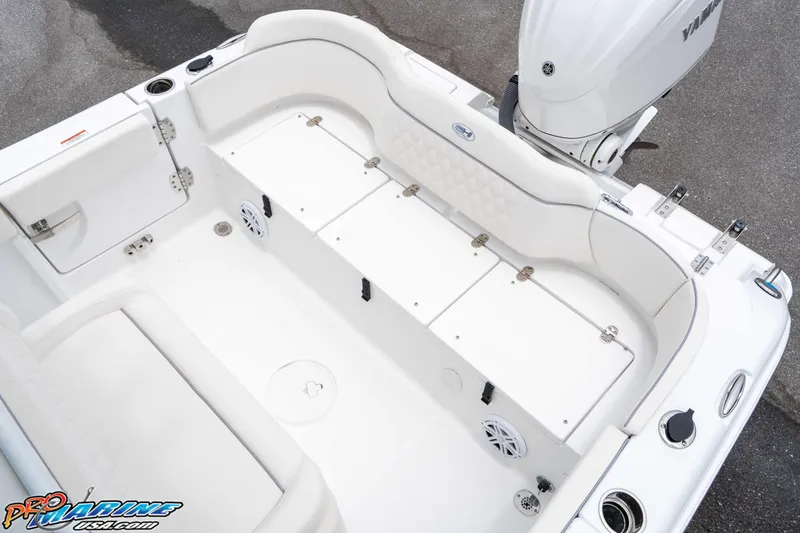 Slide: The Image of 2026 Sea Hunt Ultra 235 SE boat interior with seating and storage compartments. - 36