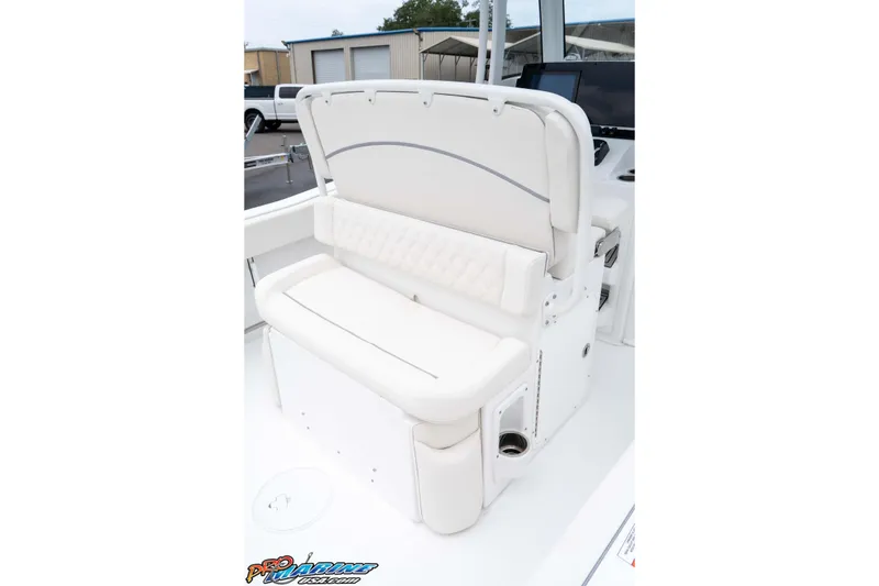 Slide: The Image of 2026 Sea Hunt Ultra 235 SE boat interior with white cushioned seating. - 38