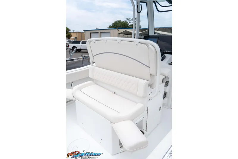 Slide: The Image of 2026 Sea Hunt Ultra 235 SE boat interior with white cushioned seating. - 39