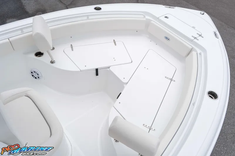 Slide: The Image of 2026 Sea Hunt Ultra 235 SE boat interior with seating and storage compartments. - 43
