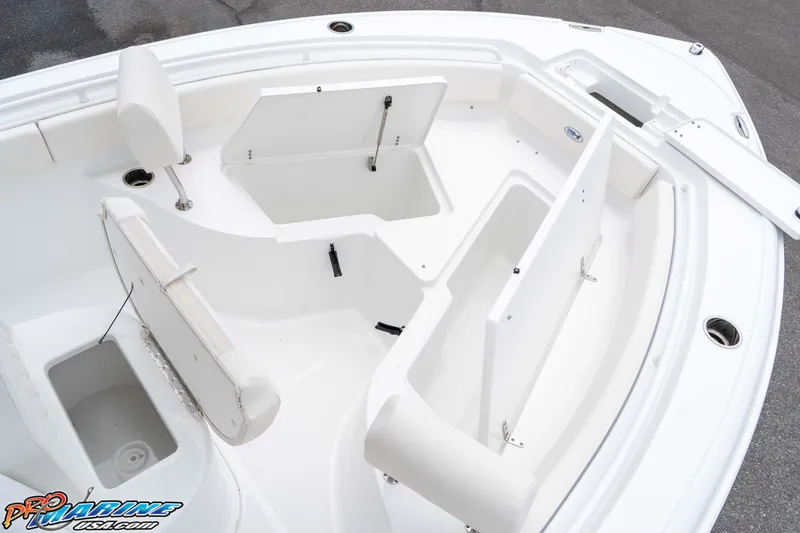 Slide: The Image of 2026 Sea Hunt Ultra 235 SE boat interior with open storage compartments. - 44
