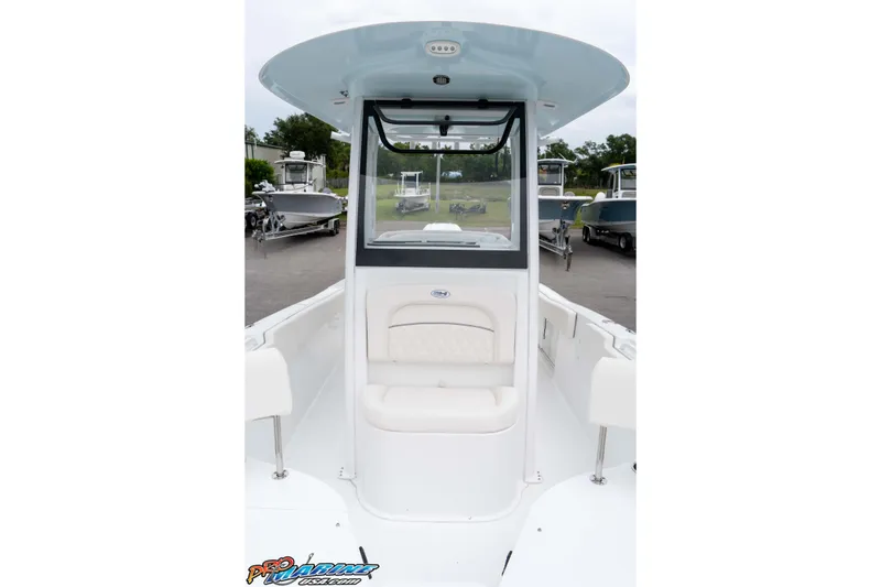 Slide: The Image of 2026 Sea Hunt Ultra 235 SE boat interior with seating and console view. - 45