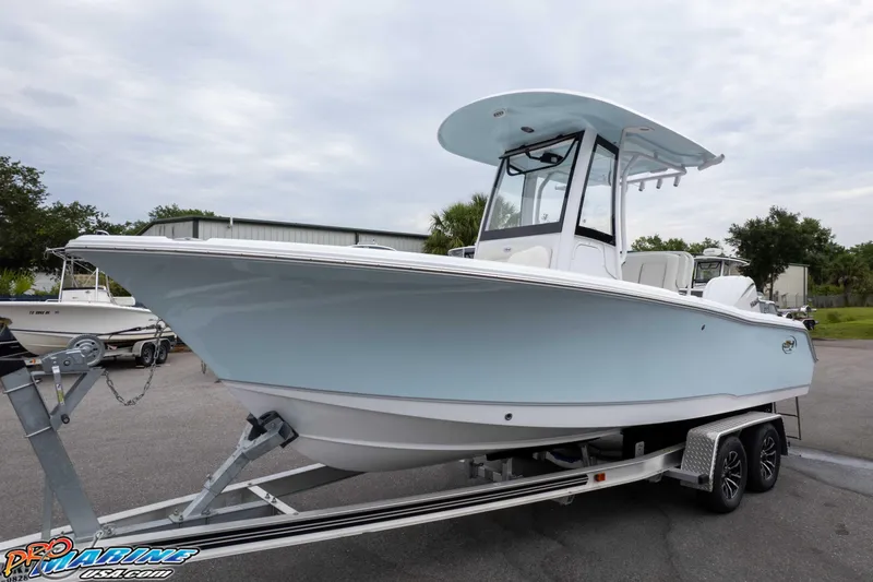 Slide: The Image of 2026 Sea Hunt Ultra 235 SE boat on trailer, displayed outdoors. - 8