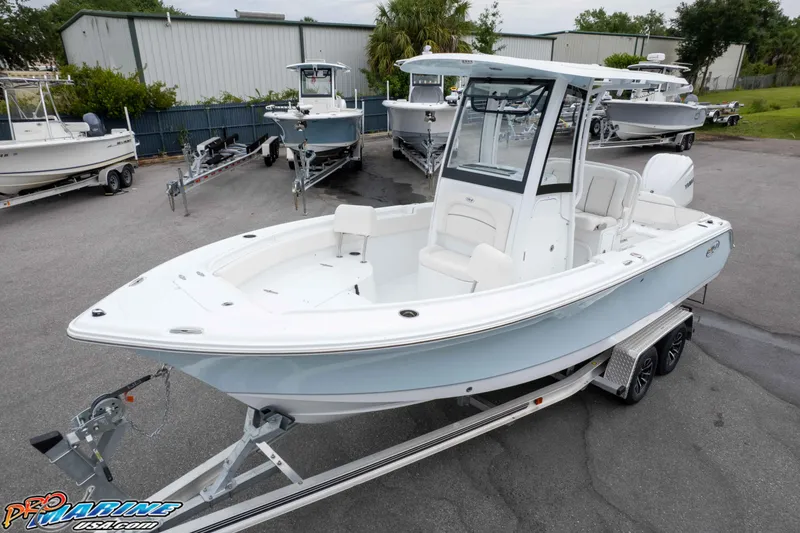 Slide: The Image of 2026 Sea Hunt Ultra 235 SE boat on trailer in dealership lot. - 9