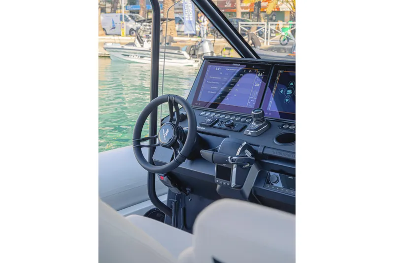 Slide: The Image of Interior view of 2026 Highfield ADV9 boat cockpit with modern navigation controls. - 7