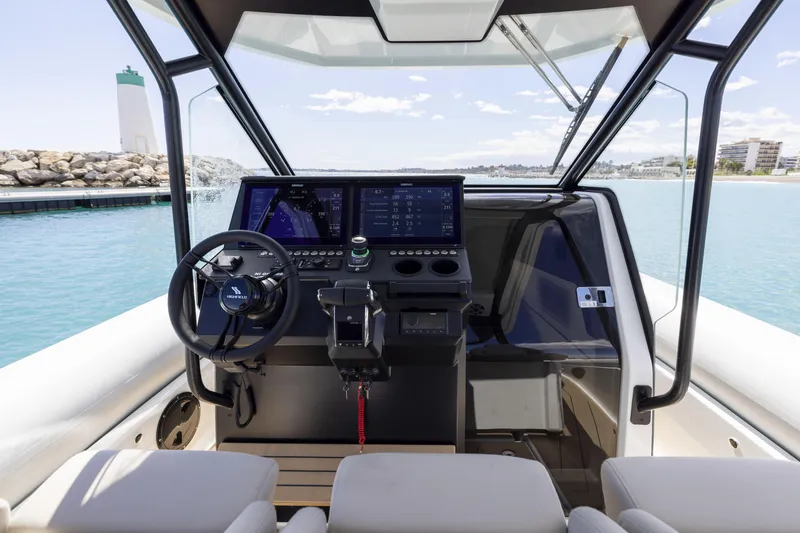 Slide: The Image of Interior view of 2026 Highfield ADV9 boat cockpit with modern navigation system. - 8