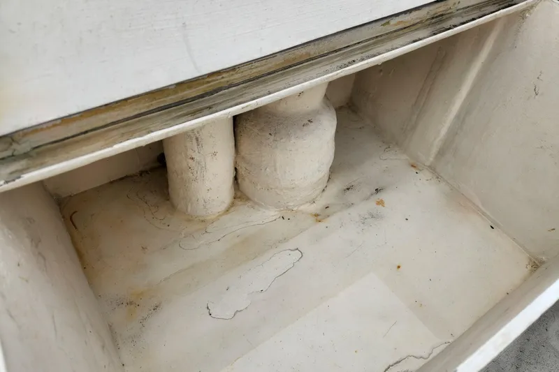 Slide: The Image of Interior compartment of a 1988 Duffy 31 Lobster Boat, showing wear and discoloration. - 16