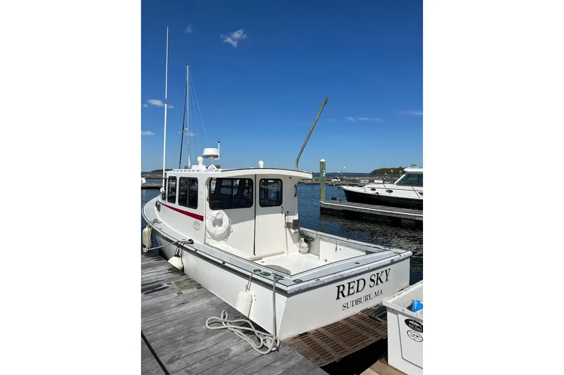 Slide: The Image of 1988 Duffy 31 Lobster Boat "Red Sky" docked at marina under clear blue sky. - 17