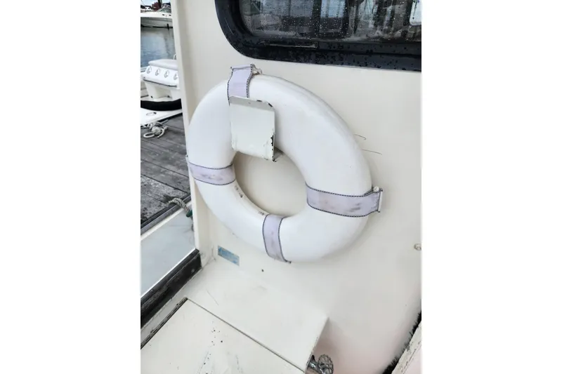 Slide: The Image of White life ring on 1988 Duffy 31 Lobster Boat, dockside view. - 22
