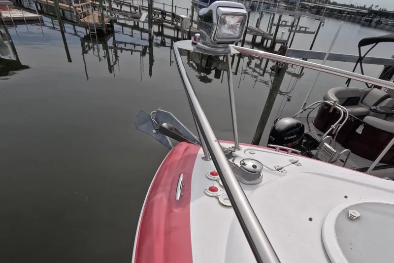 Slide: The Image of Bow view of 2012 Four Winns V265 boat docked at marina. - 68