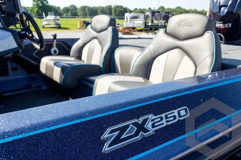 Slide: The Image of 2018 Skeeter ZX250 boat interior with sleek seats and steering wheel. - 12