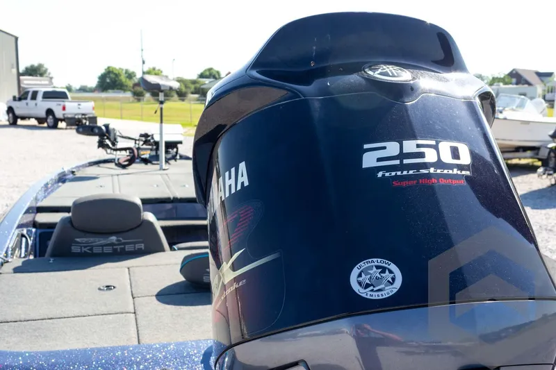 Slide: The Image of 2018 Skeeter ZX250 boat with Yamaha 250 four-stroke engine in outdoor setting. - 20