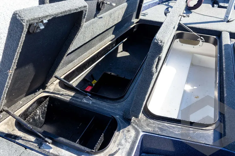 Slide: The Image of Open storage compartments on a 2018 Skeeter ZX250 boat, showcasing interior space. - 23