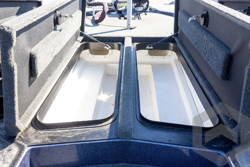 Slide: The Image of Open storage compartments on a 2018 Skeeter ZX250 boat. - 25