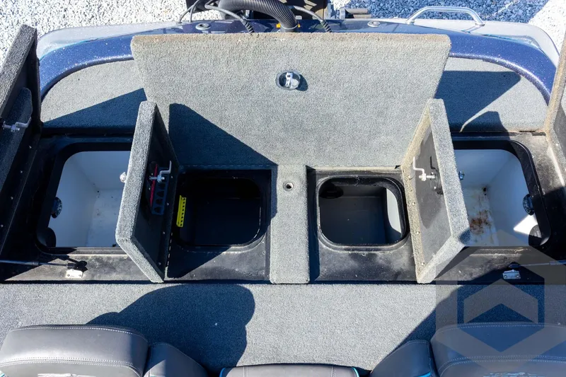 Slide: The Image of 2018 Skeeter ZX250 boat storage compartments with open lids, showcasing interior space. - 33