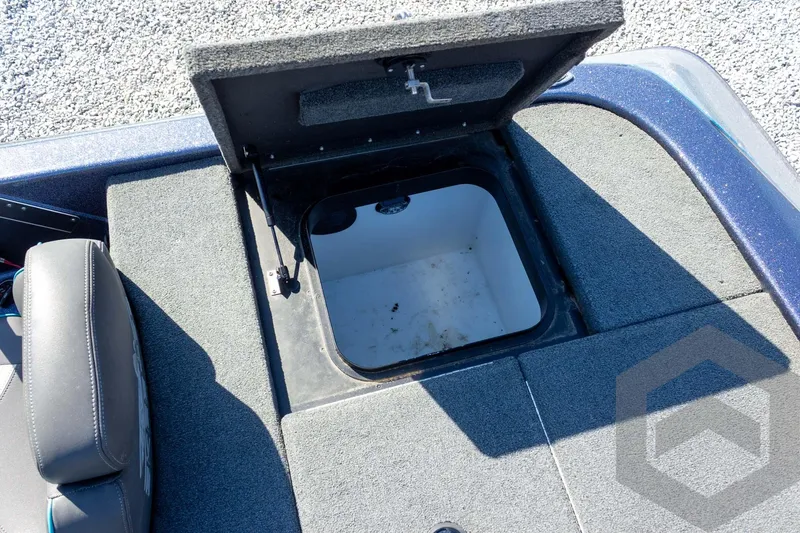 Slide: The Image of Open storage compartment on 2018 Skeeter ZX250 boat deck. - 36