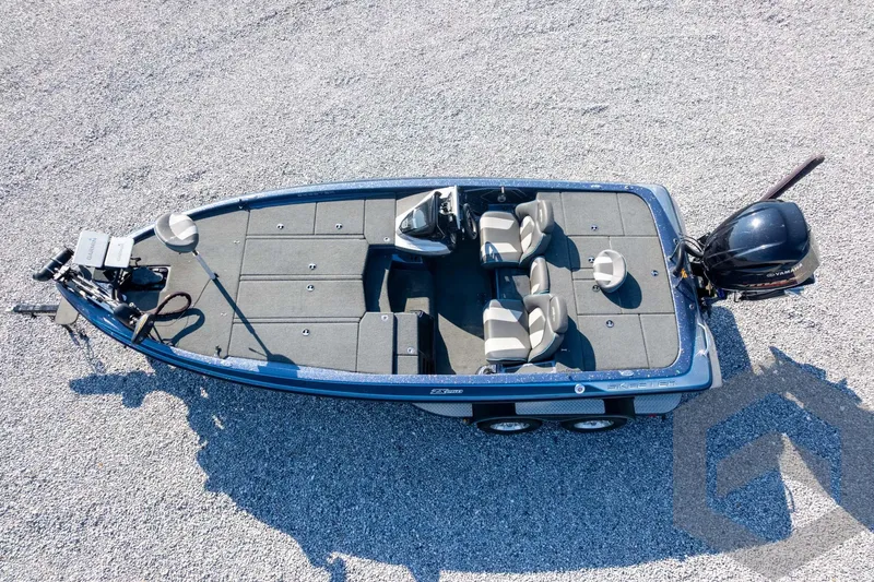 Slide: The Image of 2018 Skeeter ZX250 fishing boat on gravel, featuring spacious deck and Yamaha outboard motor. - 41