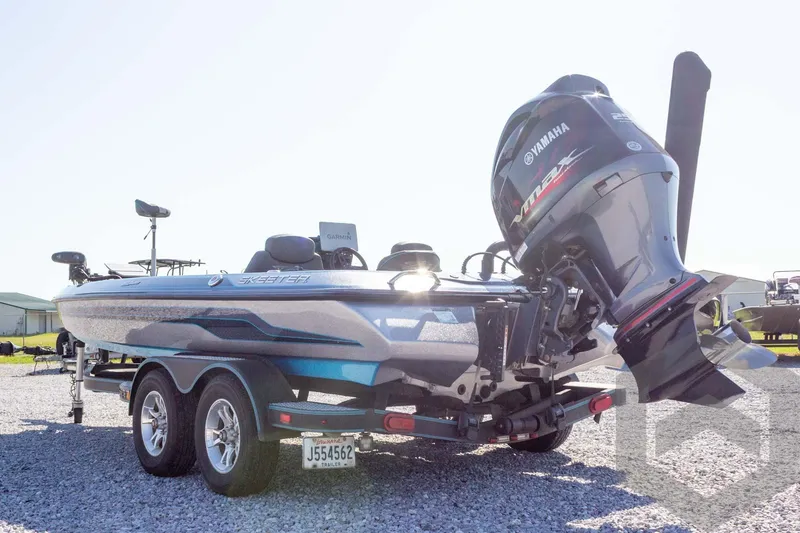 Slide: The Image of 2018 Skeeter ZX250 boat with Yamaha VMAX engine on a trailer. - 8