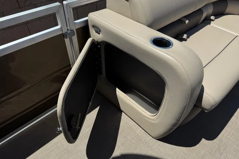 Slide: The Image of 2024 Sun Tracker SportFish 22 DLX boat seat with open storage compartment and cup holder. - 13