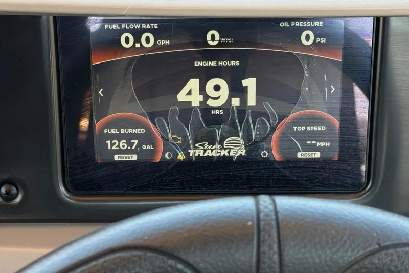 Slide: The Image of Dashboard display of 2024 Sun Tracker SportFish 22 DLX showing engine hours and fuel data. - 30